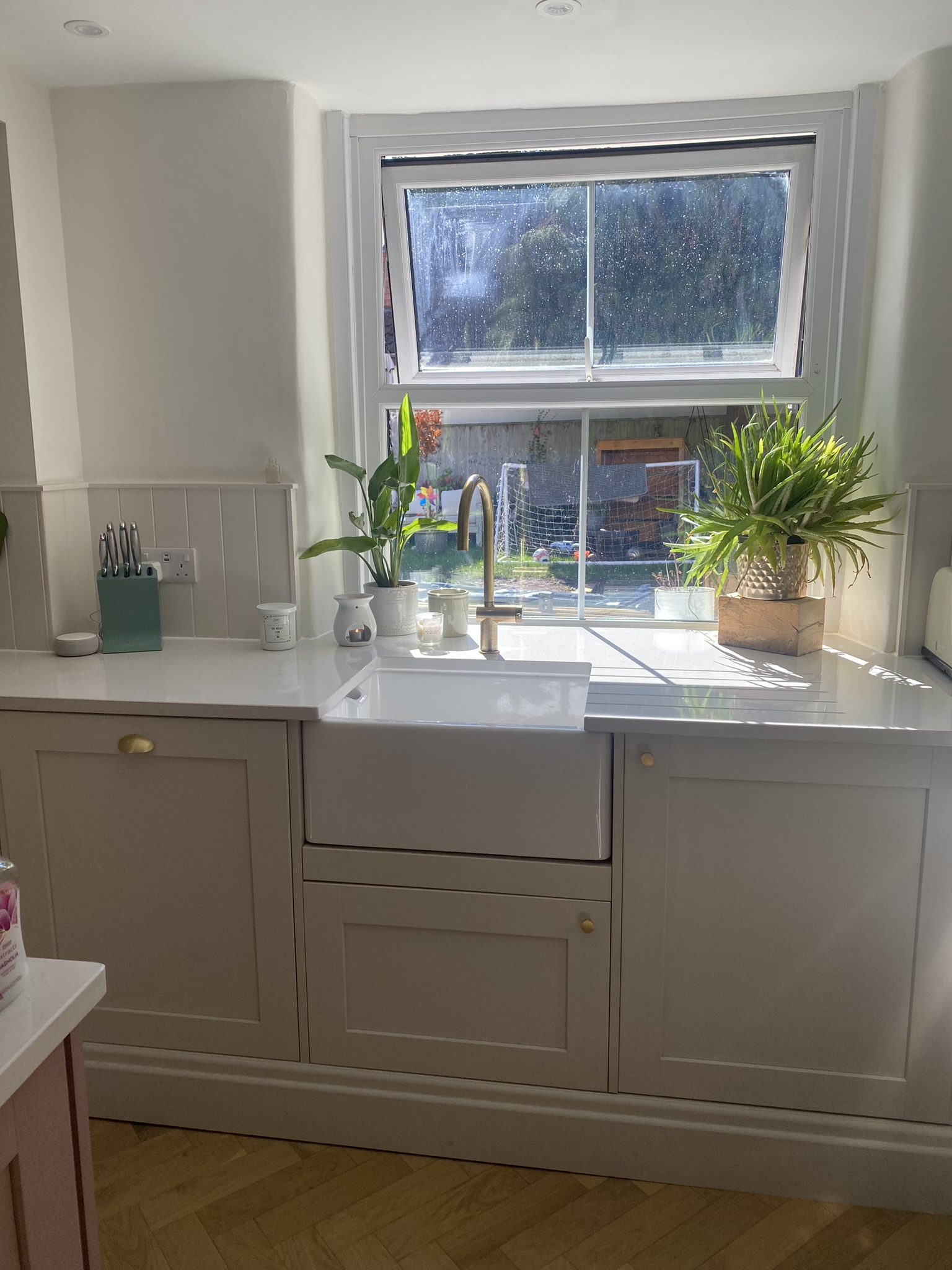 Belfast sink in a sage shaker kitchen