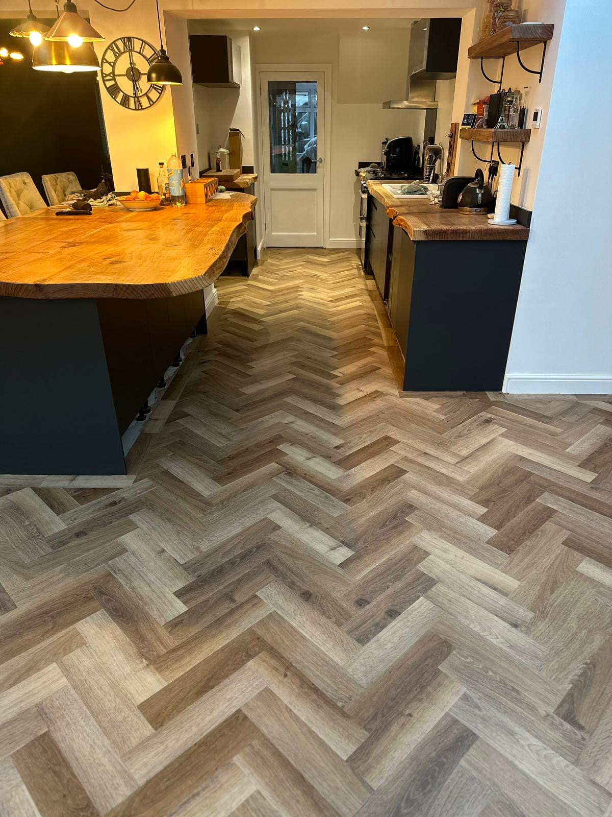 Kitchen with herringbone floor and oak worktop