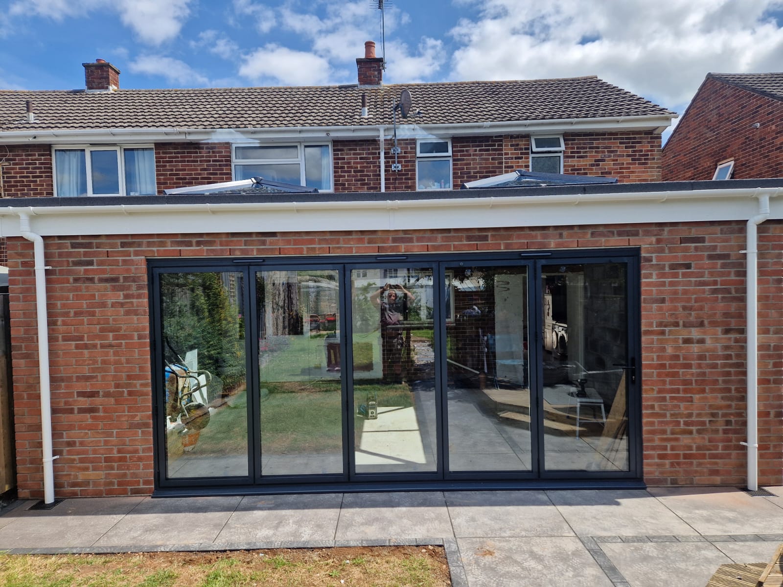Single-storey rear extension with black bifold doors