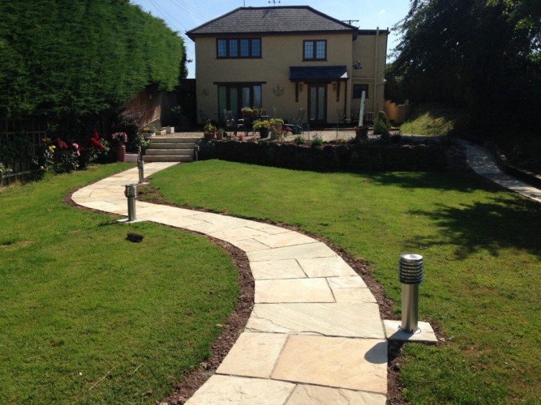 Curving stone garden path to the house