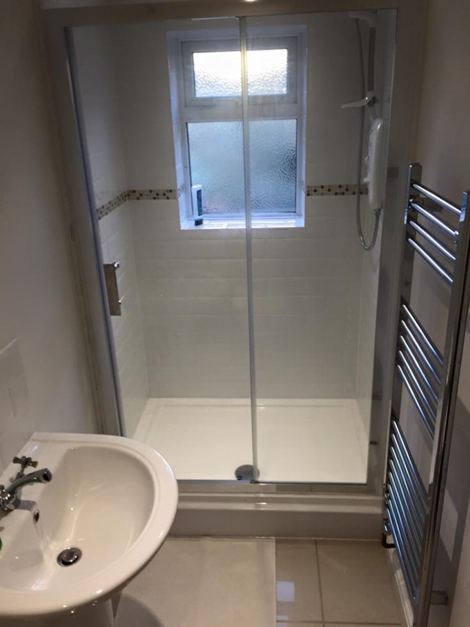 Shower room with a walk-in glass screen and towel rail