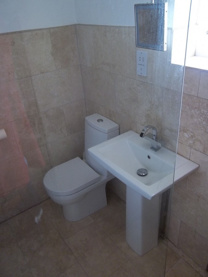 Tiled bathroom with a pedestal basin