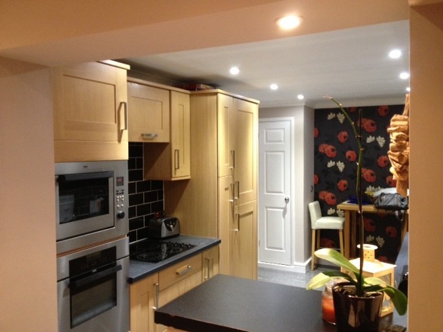 Fitted kitchen with built-in ovens and downlights