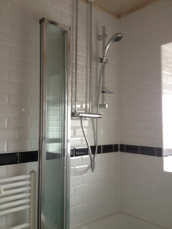 Shower screen and towel rail with metro tiling