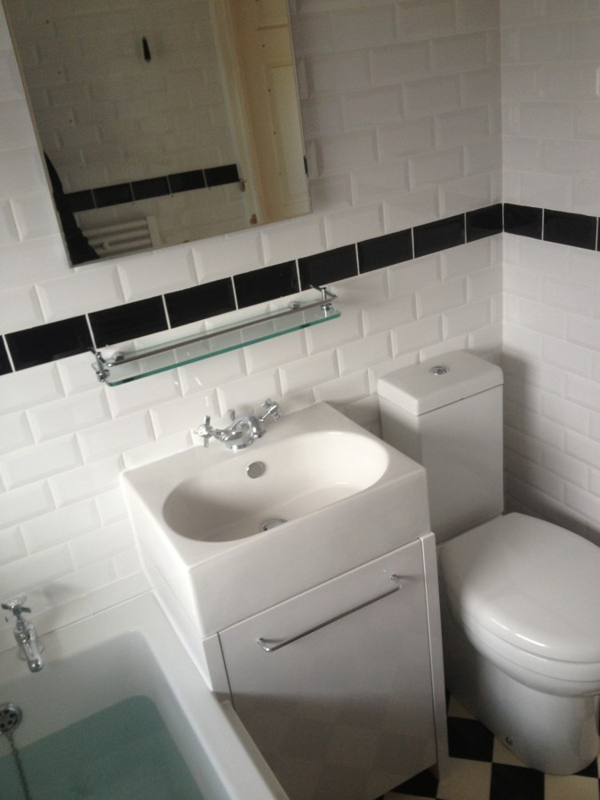 Vanity basin and toilet in a metro-tiled bathroom