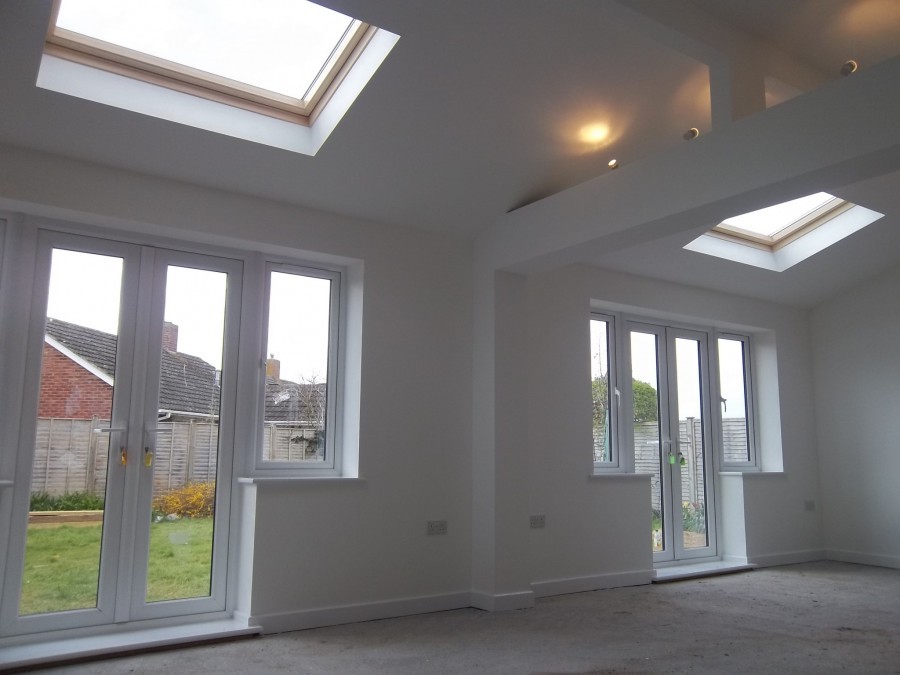 Bright extension interior with French doors and rooflights