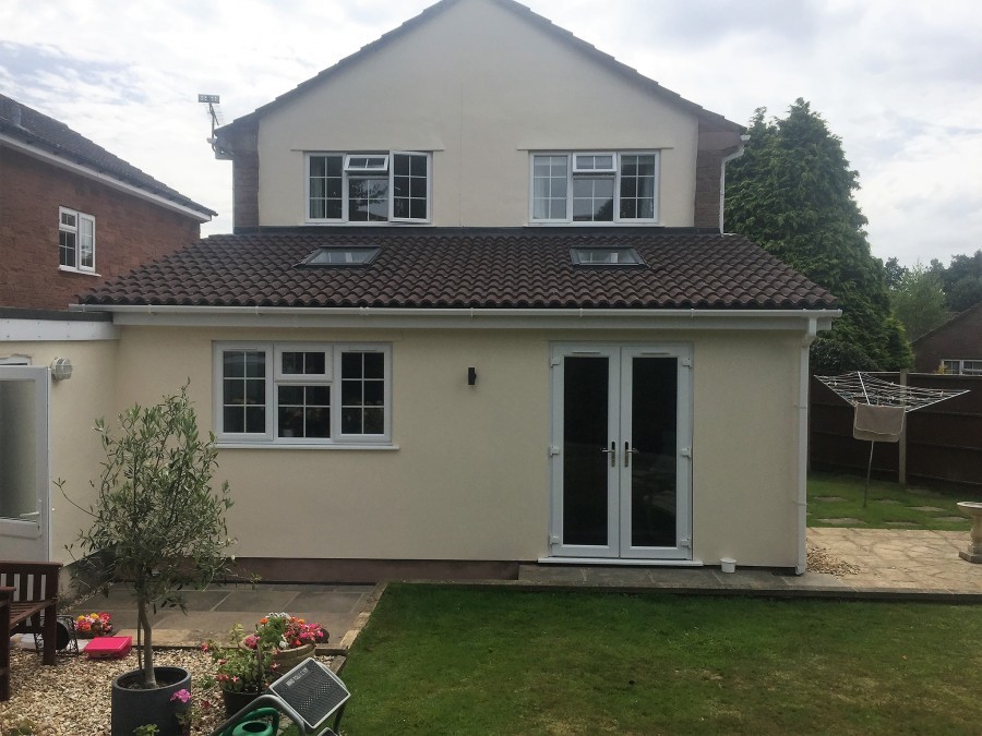 Rear extension across a detached house