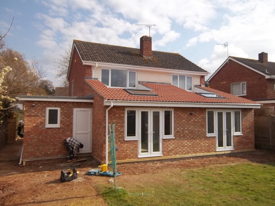 Rear extension with French doors on a red-brick house