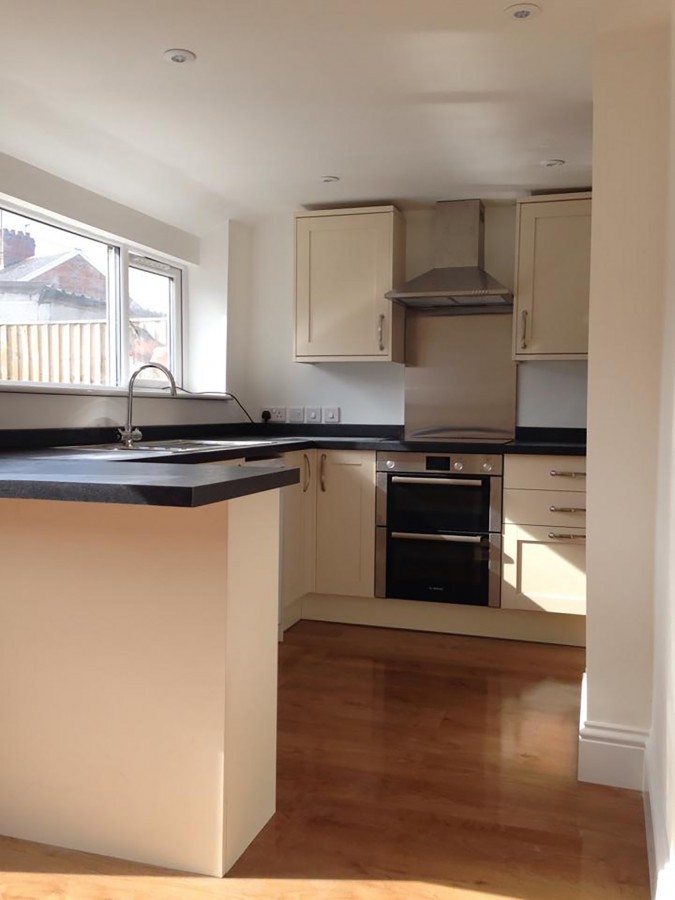 Kitchen with peninsula and timber floor