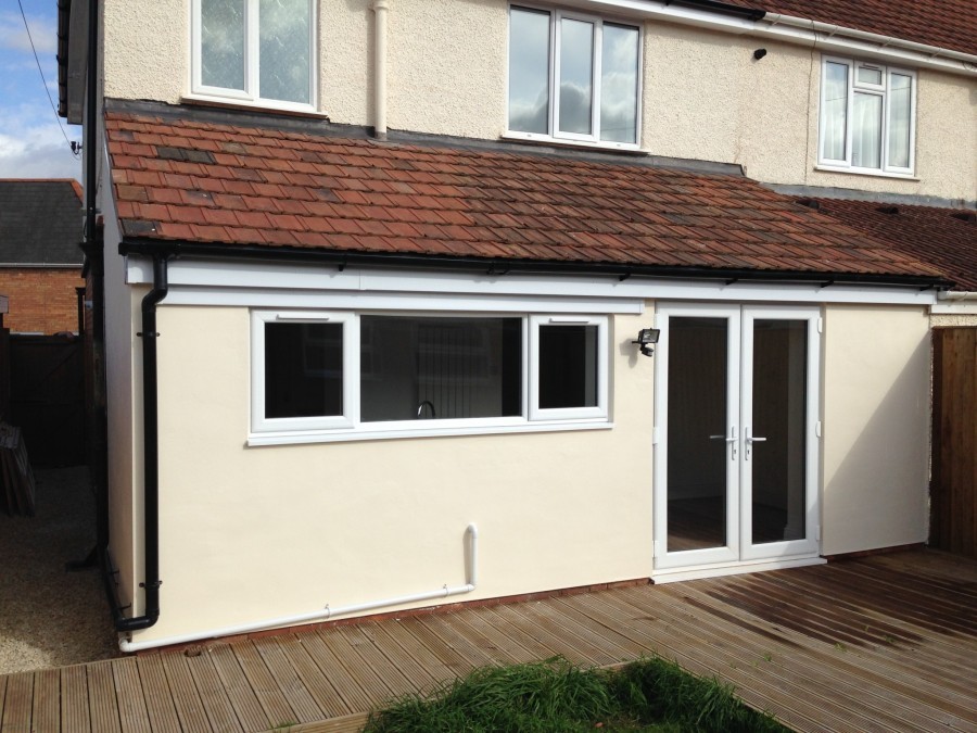 Cream rendered rear extension with decking