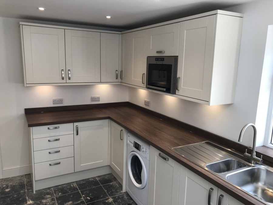 Cream shaker kitchen with oak-effect worktops