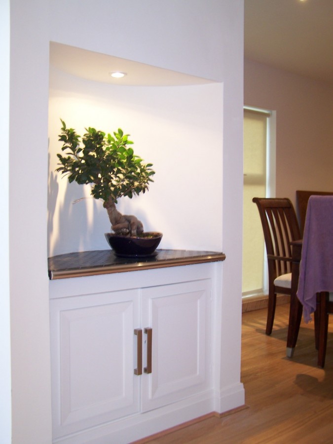 Built-in alcove cabinet with a dark worktop
